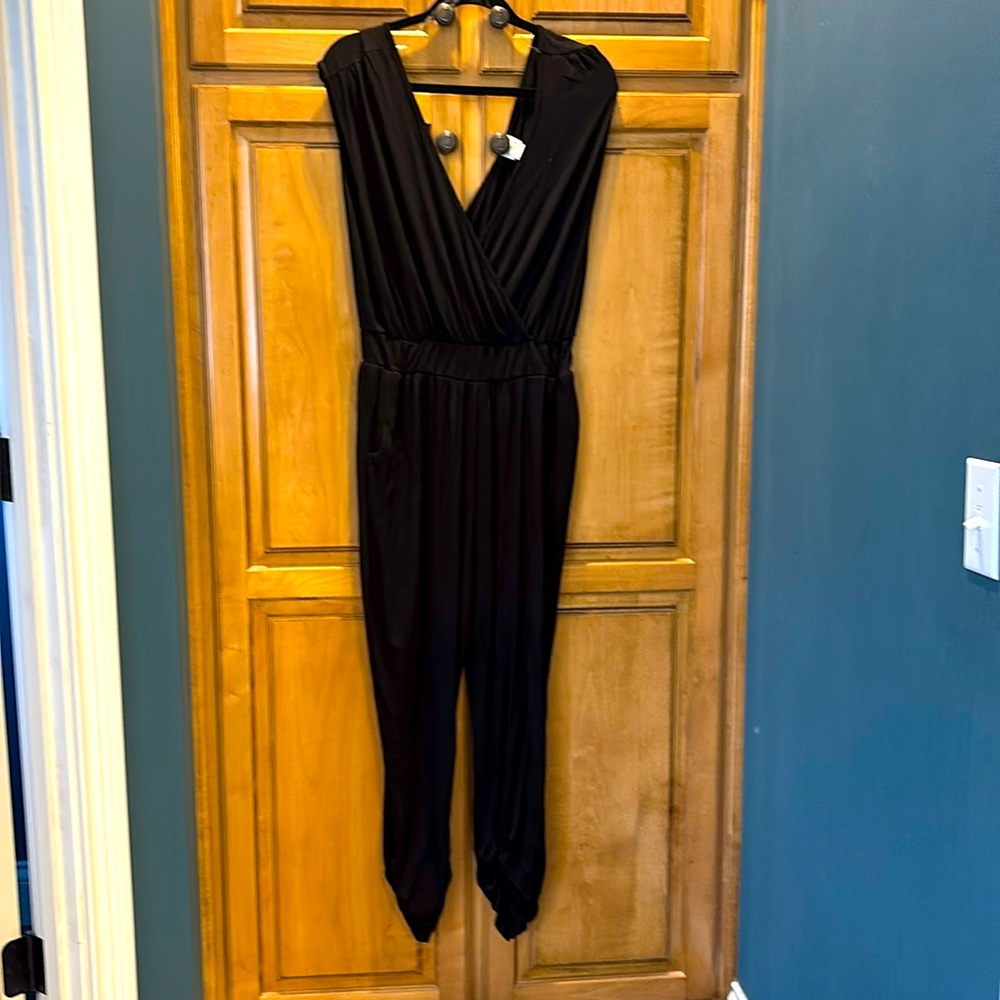 Black one piece sleeveless jumpsuits. Size 2 XL. NWOT. Only tried on, never worn